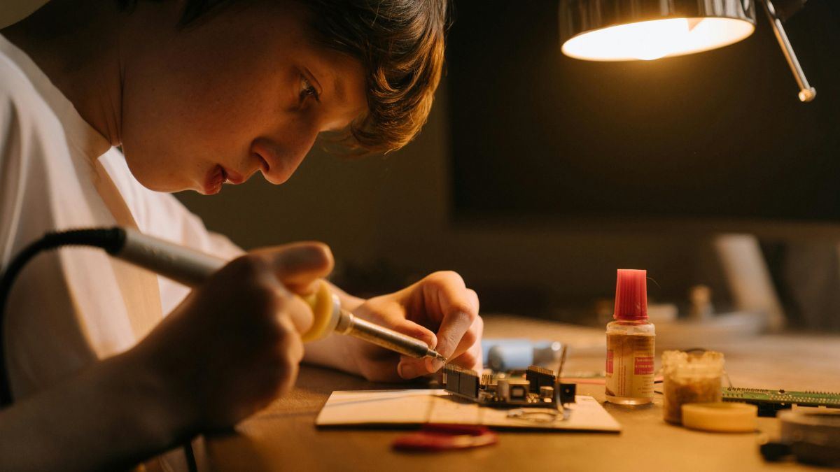 A boy soldering